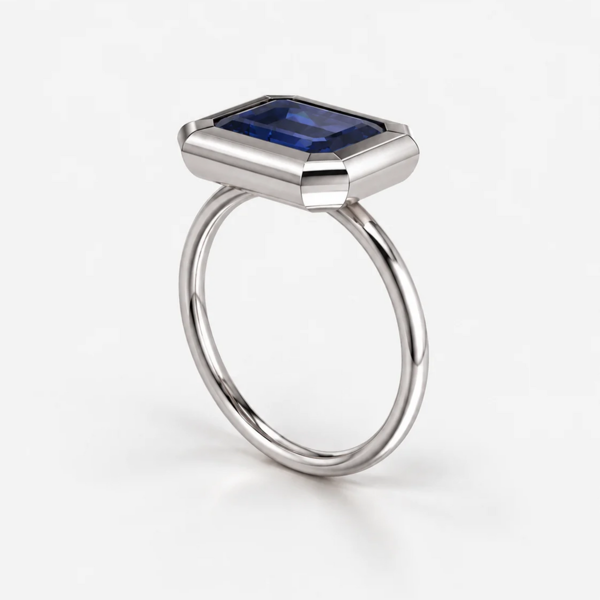 3ct East-West Double Bezel Emerald Cut Sapphire Ring